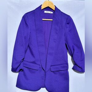 Ricki’s deep purple blazer